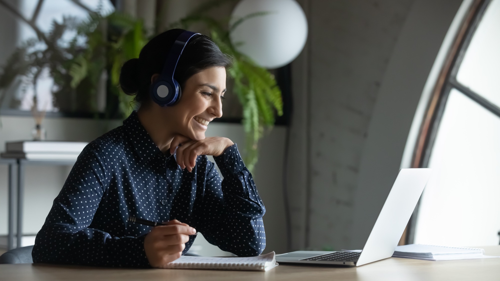 Female Employee In Wireless Earphones